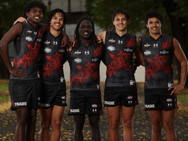 DO NOT USE BEFORE CONTACTING HERALDSUN PIC DESKÃ.MELBOURNE. 18/05/2023.  AFL .   EssendonÃs indigenous players L-R. Anthony Munkara , Alwyn Davey jnr , Anthony McDonald-Tipungwuti ,  Tex Wanganeen and Jayden Davey of the Bombers before Dreamtime at the G  .  Pic: Michael Klein