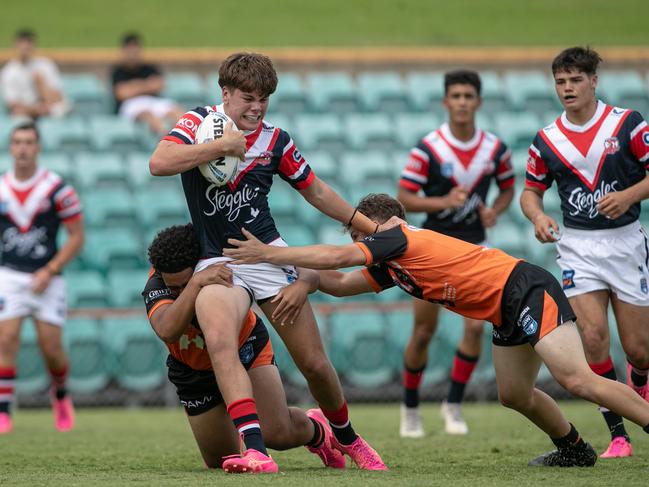 Eddy Cayless tries to break through the line. Picture: Julian Andrews