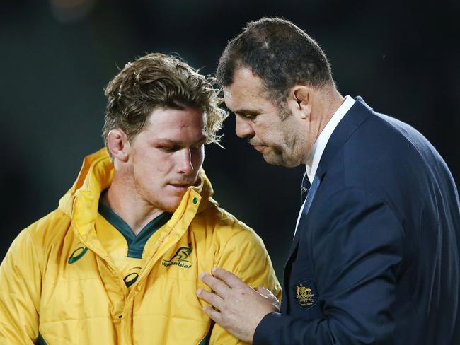 Head coach Michael Cheika chats with captain Michael Hooper after the second Bledisloe Cup Test. Picture: Getty