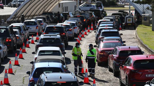 While some people were starting their summer holidays, others were lined up at the Bondi Covid testing clinic. Picture: John Grainger