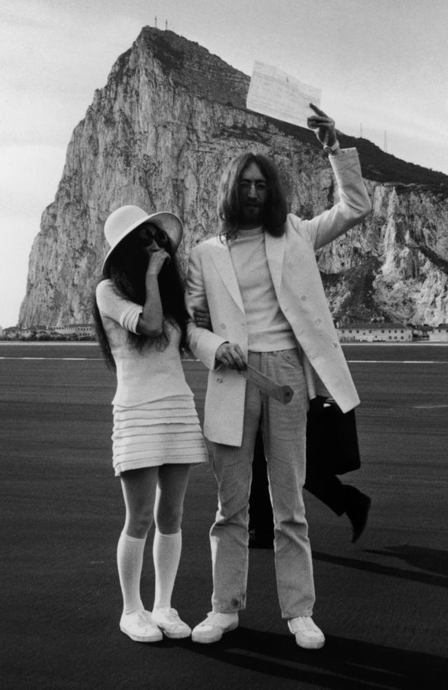 John Lennon and Yoko Ono, both dressed in white, with their marriage certificate after their wedding in Gibraltar, 20th March 1969.