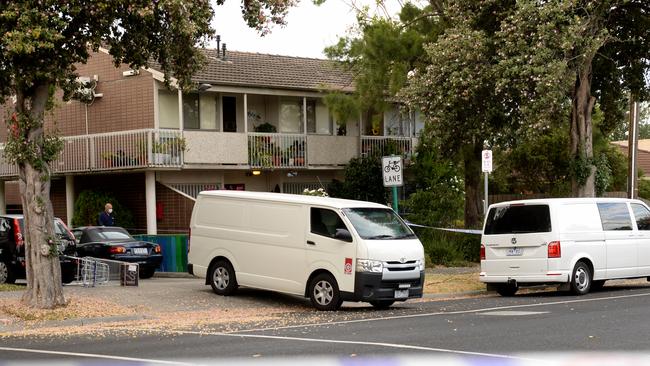 A large police presence remained at the McDonald St flats on Friday. Picture: Andrew Henshaw