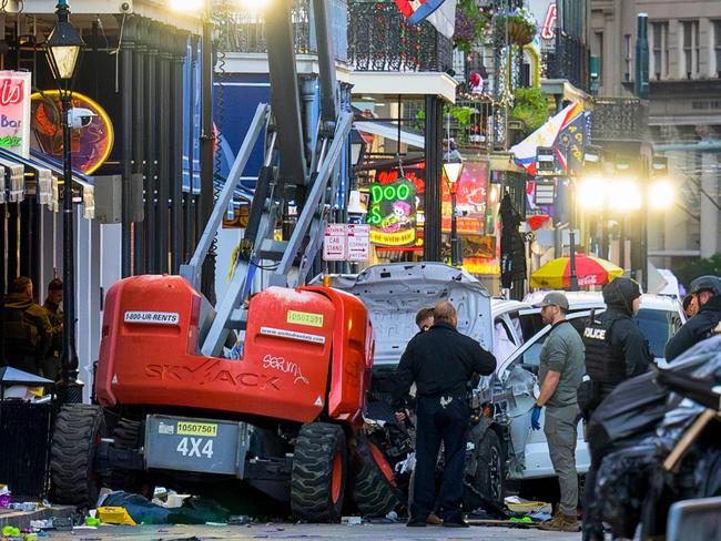 Police investigators surround a white truck that was used in the attack. Picture: AFP