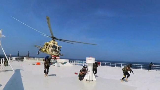 A grab from video released by Yemen's Houthi Ansarullah Media Centre reportedly shows members of the rebel group during the capture of the Galaxy Leader and its 25 international crew. Picture via AFP