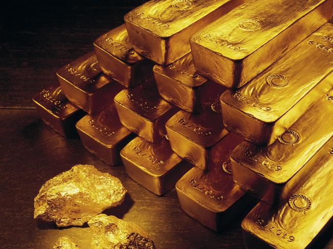 In this undated handout photo from Newmont Mining Corporation, gold nuggets and bars are shown. With the price of gold back in the mid-$500 range, the highest level since 1981, mining companies are pouring money into exploration around the world. (AP Photo/Newmont Mining)