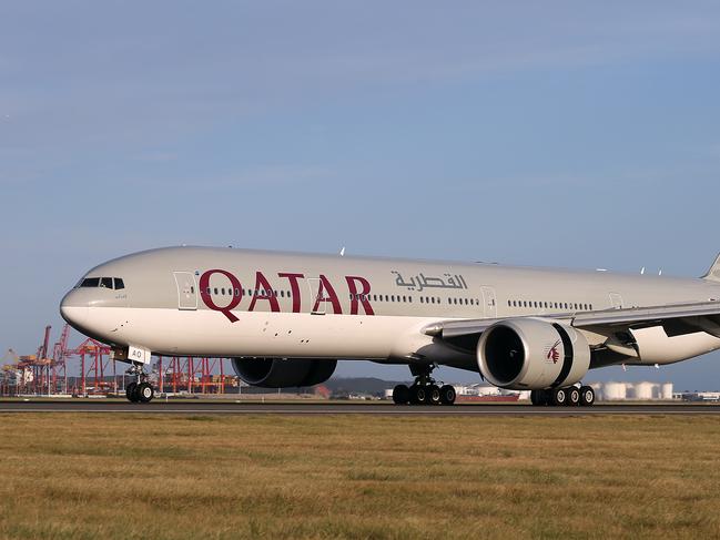 01/03/2016:A Qatar Airways  777-300 lands at Sydney Airport after its inaugural flight from Doha.The award-winning airline will fly a Boeing 777-300 daily between Sydney and Doha.Pic by James Croucher