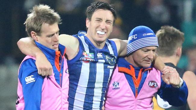 Sam Wright comes off injured. North Melbourne V Richmond at Blundstone Arena Hobart. Picture: NIKKI DAVIS-JONES