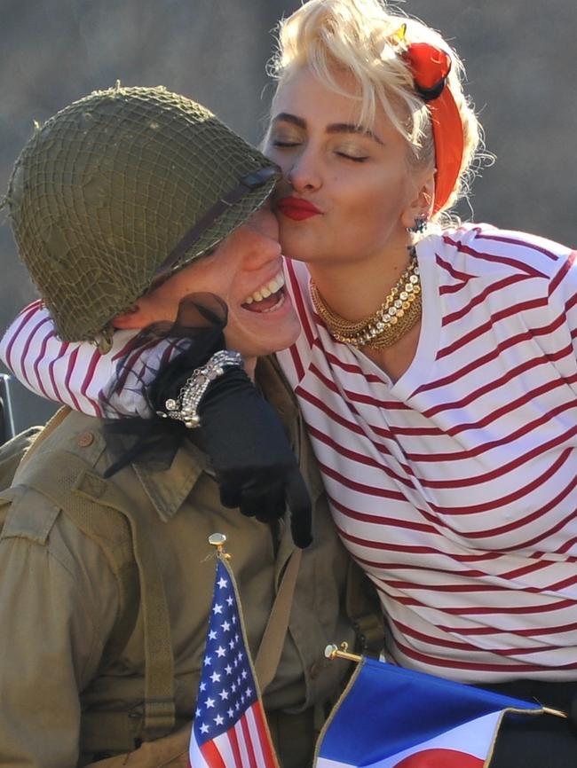 Jackson plants a kiss on another model. Picture:  E-PRESS/Backgrid