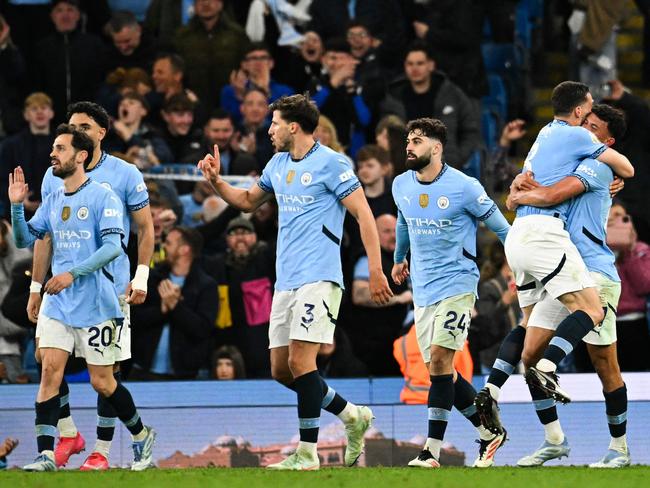 Manchester City celebrate their late winner. Picture: Oli Scarff/AFP