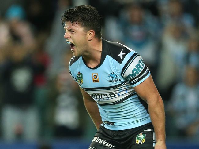 Chad Townsend scores a try against the Cowboys.