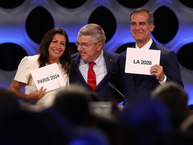 Paris Mayor Anne Hidalgo, IOC President Thomas Bach and Los Angeles Mayor Eric Garcetti react after the confirmation of Paris and LA as the Games’ 2024 and 2028 hosts. Picture: Buda Mendes/Getty Images