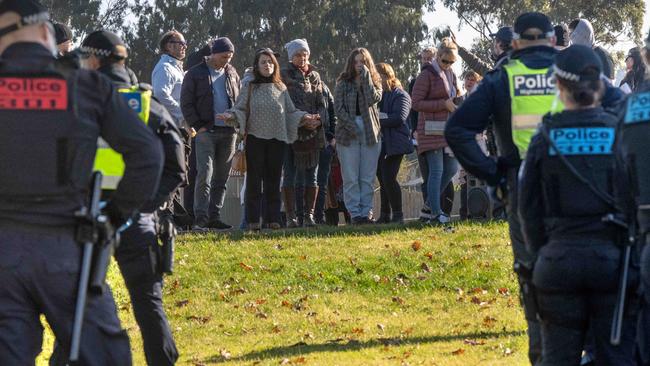 Churchgoers faced off with police. Picture: Tony Gough