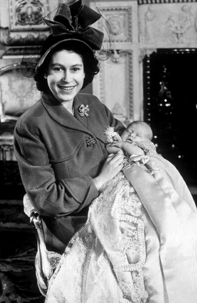 Her Majesty Queen Elizabeth II pictured when she was Princess Elizabeth with her first baby Prince Charles at his christening in 1948. Picture: Mirrorpix/Getty Images