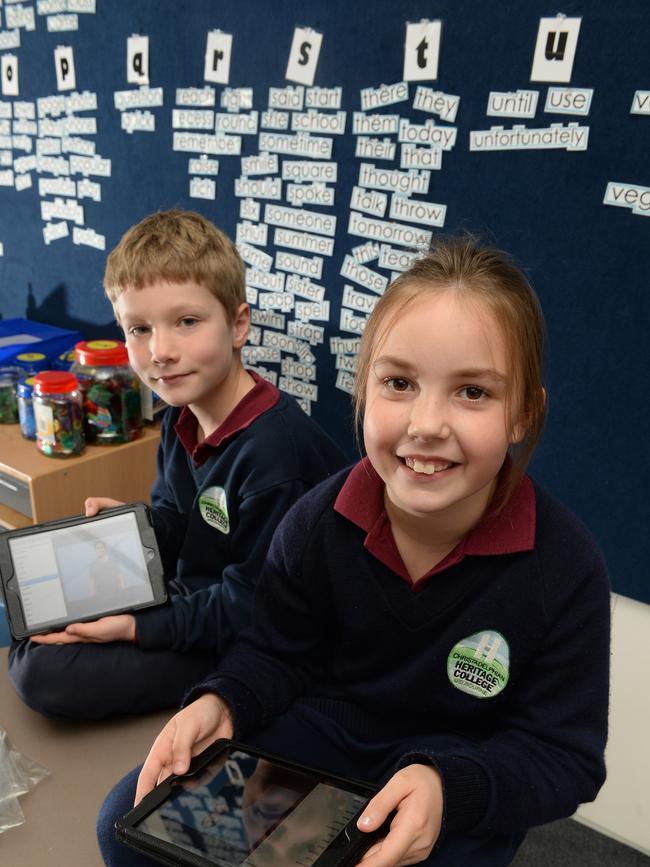 Christadelphian Heritage College Melbourne at The Basin received a grant to purchase iPads to help students with their Auslan classes. School Principal Jon Fry with Grade 3 students Aidan and Sophie showing off their sign language skills and the iPads.