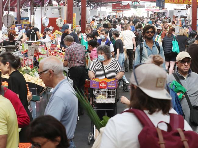 People shop at Victoria Market for their Christmas food. Friday, December 23, 2022. Picture: David Crosling