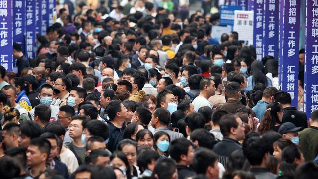 People attend a job fair in China's southwestern city of Chongqing as unemployment among Chinese youths jumped to a record 20.8 per cent in May. Picture: AFP