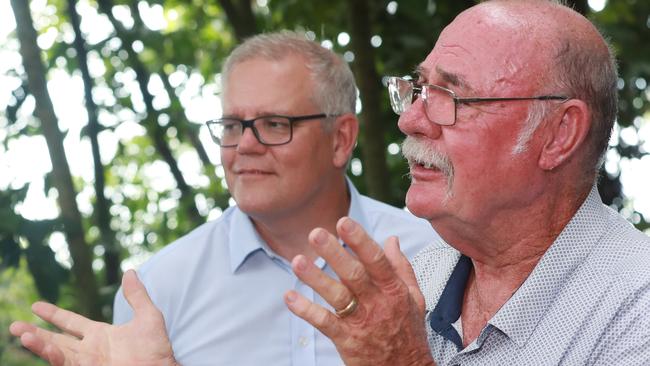 Prime Minister Scott Morrison watches Member for Leichhardt and Special Envoy for the Great Barrier Reef Warren Entsch speak at Green Island in January. Picture: Brendan Radke