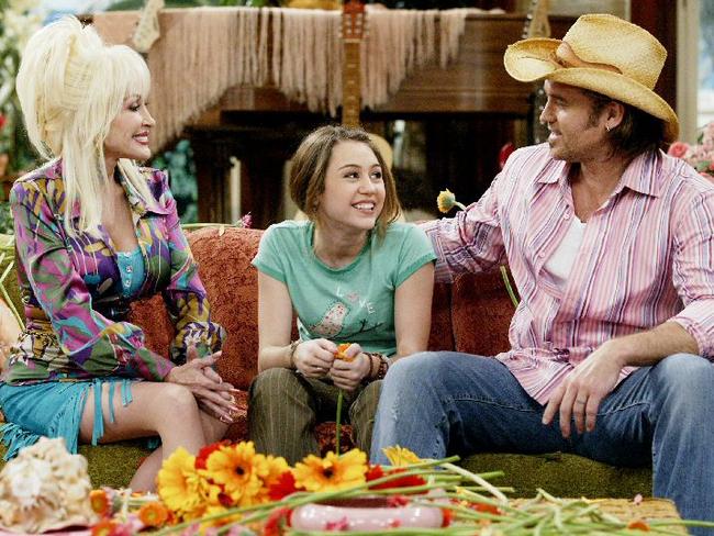 Close ... Dolly Parton, who is Miley Cyrus’ godmother, has been accused of having an affair with her father, Billy Ray Cyrus. Picture: Supplied