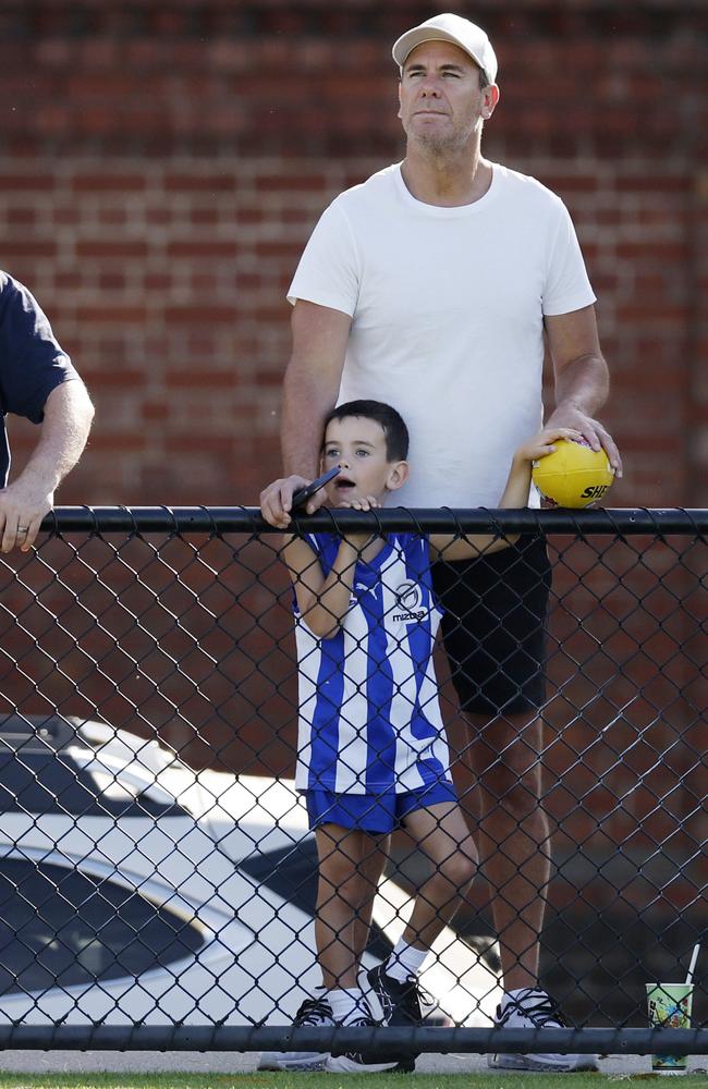 North Melbourne great Wayne Carey and son Carter were at Arden Street. Picture: Michael Klein