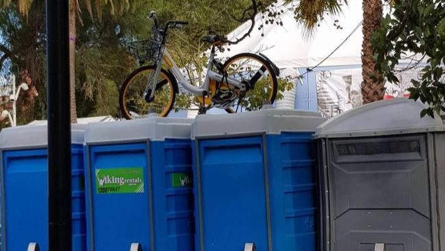 An oBike stranded on top of portable toilets in Prahran. Pic: imgur