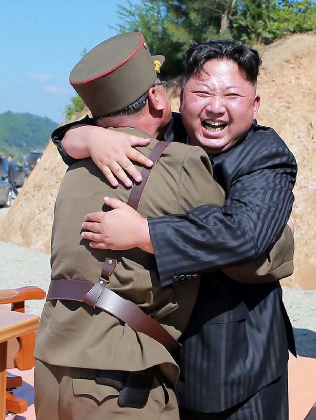 An elated North Korean leader Kim Jong-un celebrates the successful test-fire of the intercontinental ballistic missile Hwasong-14 Picture: AFP / KCNA