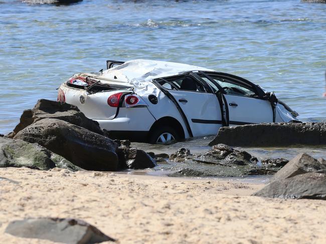 The scene at Bar Beach, Newcastle, where a car plunged of a car park lookout into the sea. Picture by Peter Lorimer.