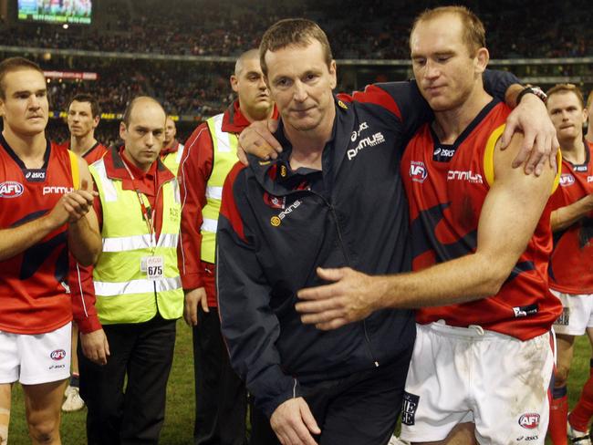 David Neitz hugs Neale Daniher in his last game as coach of the Demons.