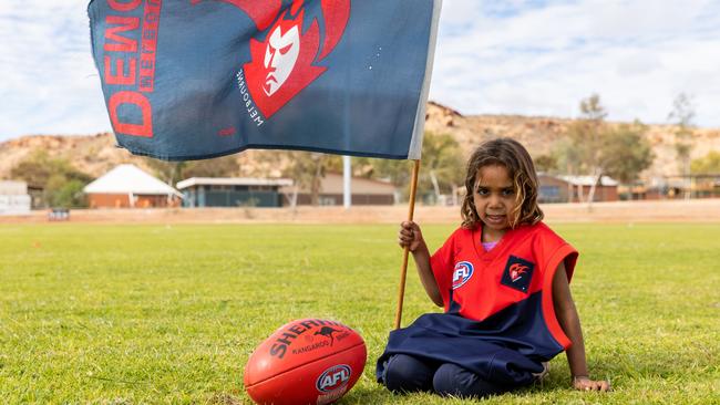 Shalaya Young, 4, on the newly grassed oval — which saw the town come together as one to achieve. Picture: Emma Murray