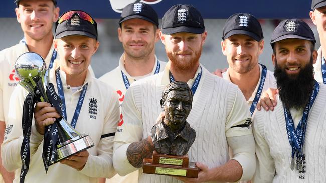 England captain Joe Root (l) Ben Stokes and Moeen Ali pictured with the silverware after day four of the 4th Investec Test match between England and South Africa.
