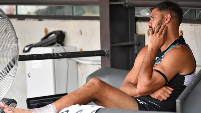 An injured Patrick Ryder of the Power is seen on the bench during Round 1.