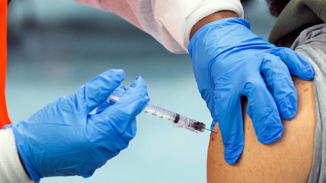 In this file photo taken on January 10, 2021, a man receives a dose of a Covid-19 vaccine. (Photo by Kena Betancur / AFP)