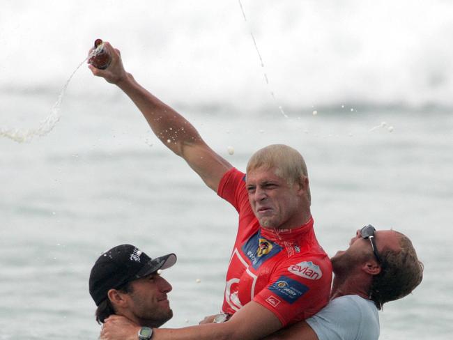 MARCH 08, 2005: Joel Parkinson and Nathan Hedge help Mick Fanning (centre) celebrate winning the Quiksilver Pro at Snapper Rocks. PicKate/Czerny