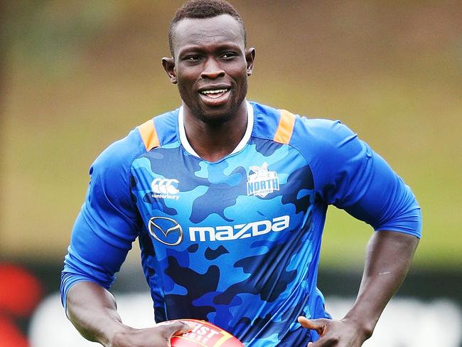 MELBOURNE, AUSTRALIA - MAY 24: Majak Daw of the Kangaroos runs with the ball during the North Melbourne Kangaroos AFL training session at Arden Street Ground on May 24, 2018 in Melbourne, Australia.  (Photo by Michael Dodge/Getty Images)