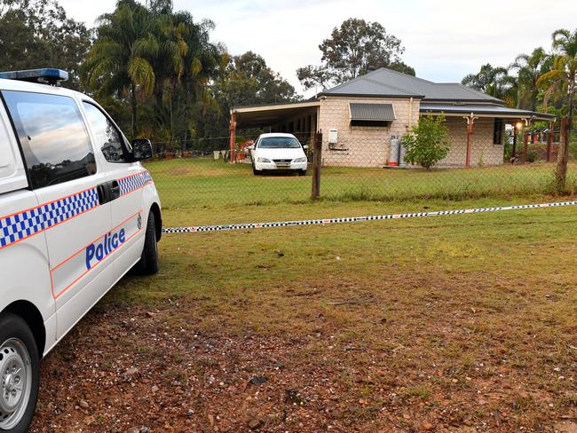 Police at a house in Buccan, south of Brisbane, where a teenage girl was believed to have been murdered. (AAP Image/Darren England)