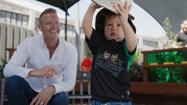 Little Scholars founder Jae Fraser with one of the children who attends his child care services.