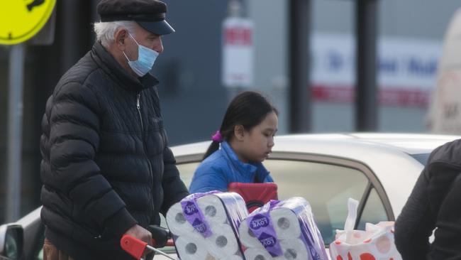 Shoppers stock up on toilet paper in Melbourne. Picture: Paul Jeffers.