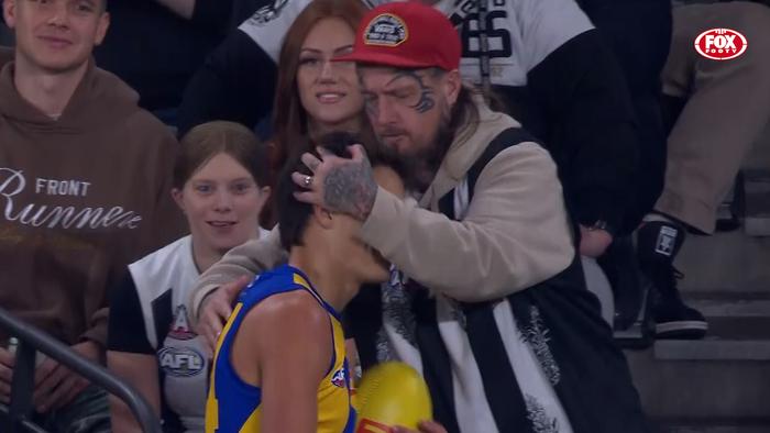 Harvey Johnston is touched by a Collingwood fan