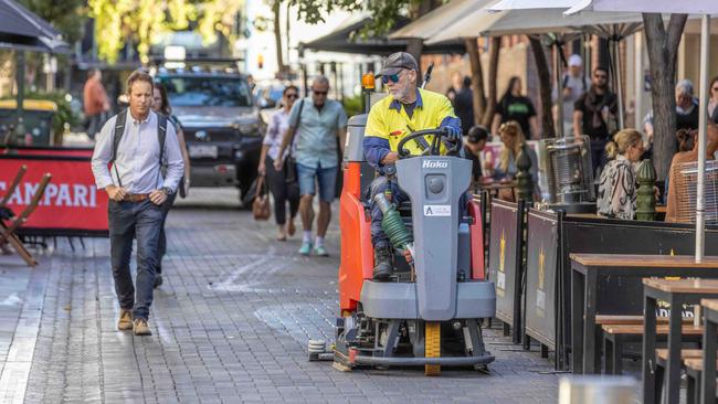 A council worker cleans Leigh St of bird poo. Picture: Ben Clark