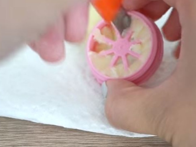 Ensure every part of the balm comes out of the container. Picture: Youtube/Cute Life Hacks.