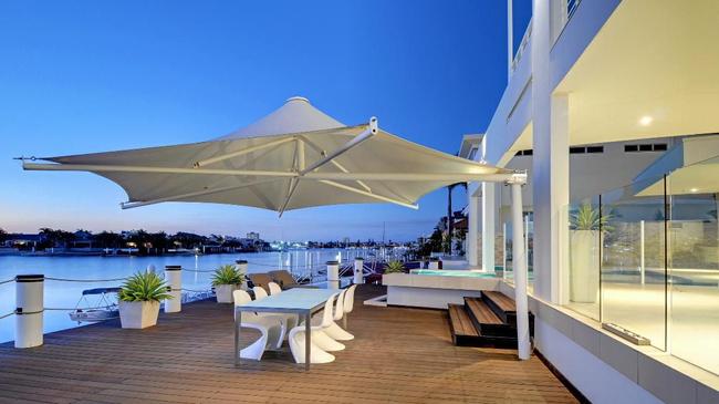 Outdoor entertaining area and deck of a waterfront Minyama home. Picture: Brad Filliponi