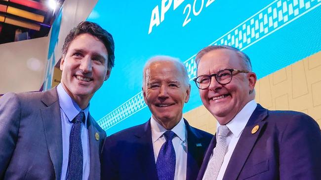 US President Joe Biden (C), Canada's Prime Minster Justin Trudeau (L) and Prime Minister Anthony Albanese posing for a picture during the APEC Summit.