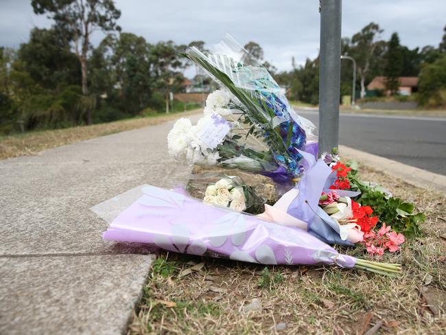 Flowers are placed next to the road where Alex Ioane was beaten to death during a brawl in Ingleburn. Picture: Richard Dobson