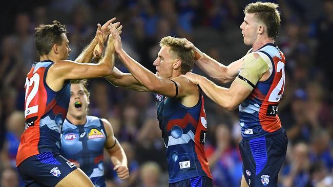 Aaron Naughton is mobbed by teammates after kicking a goal. Picture: Getty Images