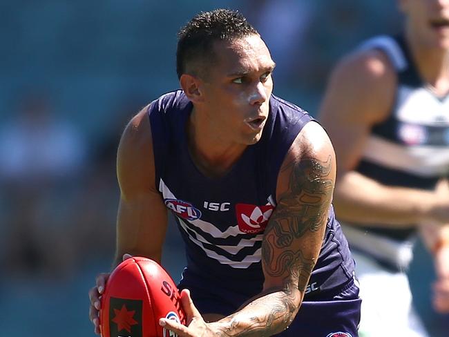 PERTH, AUSTRALIA - MARCH 12: Harley Bennell of the Dockers gathers the ball during the NAB Challenge match between the Fremantle Dockers and the Geelong Cats at Domain Stadium on March 12, 2016 in Perth, Australia.  (Photo by Paul Kane/Getty Images)