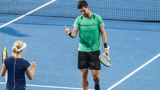 Thanasi Kokkinakis and Daria Gavrilova celebrate winning a point in the doubles. Picture: Getty Images