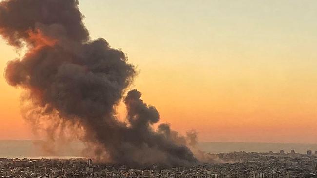 Smoke rises above Beirut's southern suburbs during the strike. Picture: AFP.