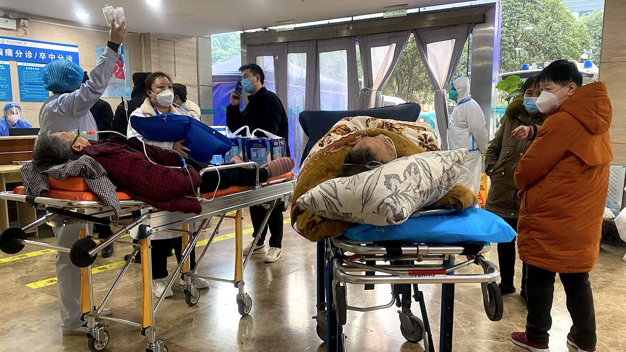 Patients are lining up in stretchers outside of emergency wards as hospitals, prompting suspicions of a cover up. Picture: Noel Celis / AFP.