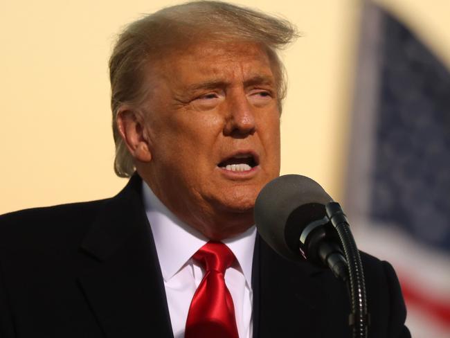 ROCHESTER, MINNESOTA - OCTOBER 30: U.S. President Donald Trump speaks during a campaign rally at Rochester International Airport October 30, 2020 in Rochester, Minnesota. With Election Day only four days away, Trump is campaigning in Minnesota despite the recent surge in coronavirus cases in the state. In accordance with state orders, only 250 people will be able to attend the rally with Trump while thousands of others will gather outside the airport to watch on a large television screen.   Chip Somodevilla/Getty Images/AFP == FOR NEWSPAPERS, INTERNET, TELCOS & TELEVISION USE ONLY ==