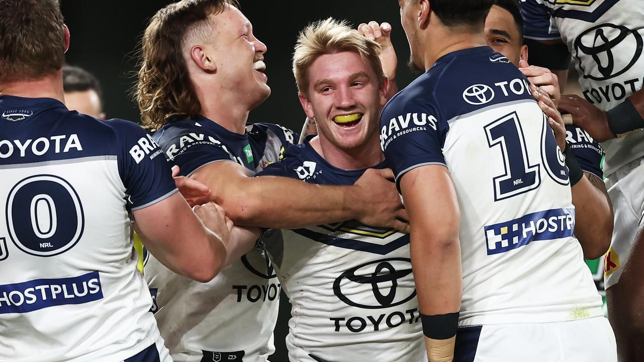 SYDNEY, AUSTRALIA - JUNE 25: Tom Dearden of the Cowboys celebrates with teammates after scoring a try during the round 17 NRL match between South Sydney Rabbitohs and North Queensland Cowboys at Accor Stadium on June 25, 2023 in Sydney, Australia. (Photo by Matt King/Getty Images)