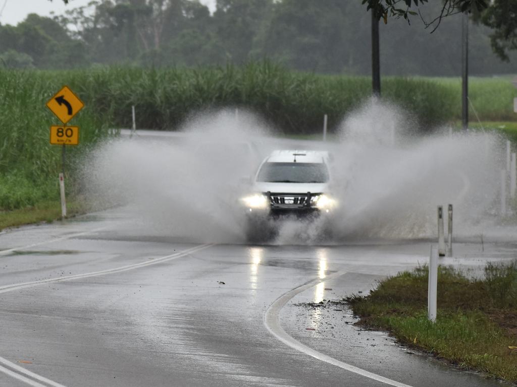 The Gairloch section of the Bruce Highway between Ingham and the Cardwell ranges, pictured this morning, is currently underwater after continued overnight rains but remains open. Photograph: Cameron Bates